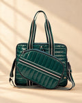 The Roqueta Bag in dark green glossy quilting with striped handles