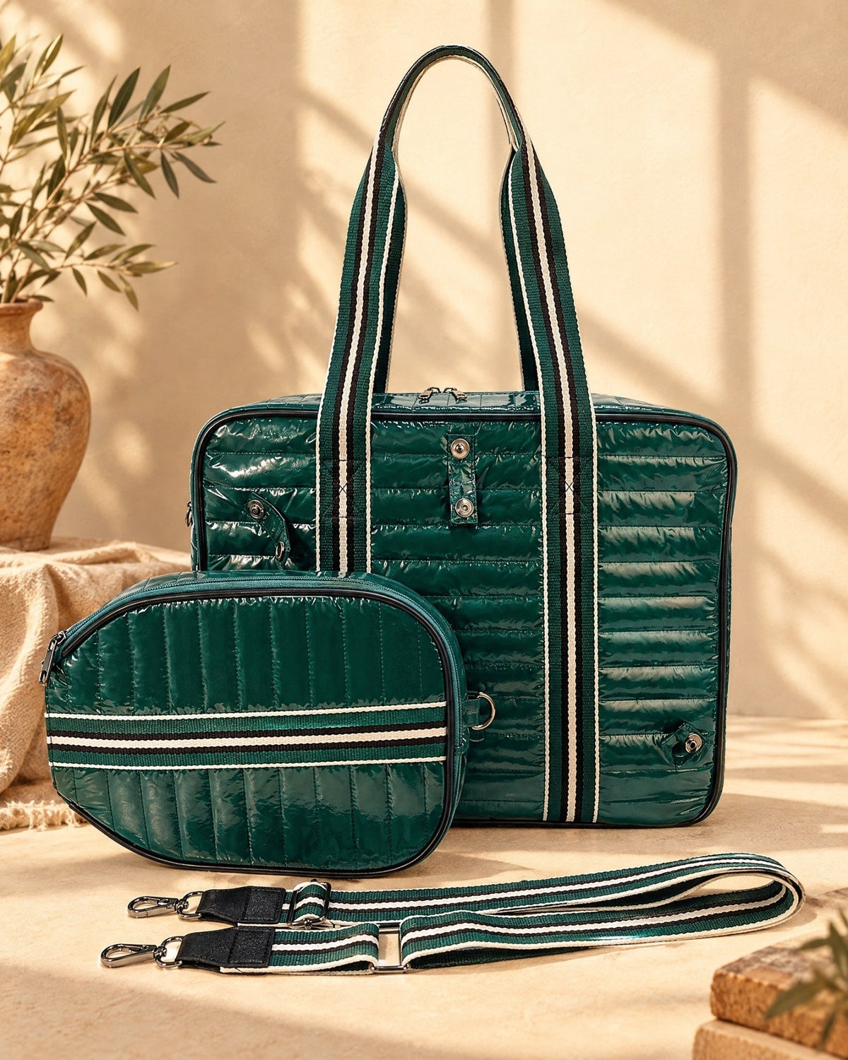 The Roqueta with its paddle-shaped cover detached and its long striped strap beside it